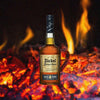 George Dickel Bourbon Whisky Aged 8 Years Bottle over background image of a fire.