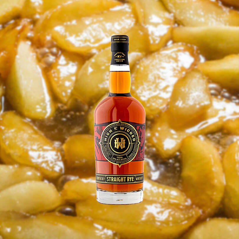 Bottle of High N' Wicked 5 Year Old Kentucky Straight Rye over backdrop of pie filling.