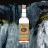Bottle of Titos Handmade Vodka over blurred image of a waterfall.