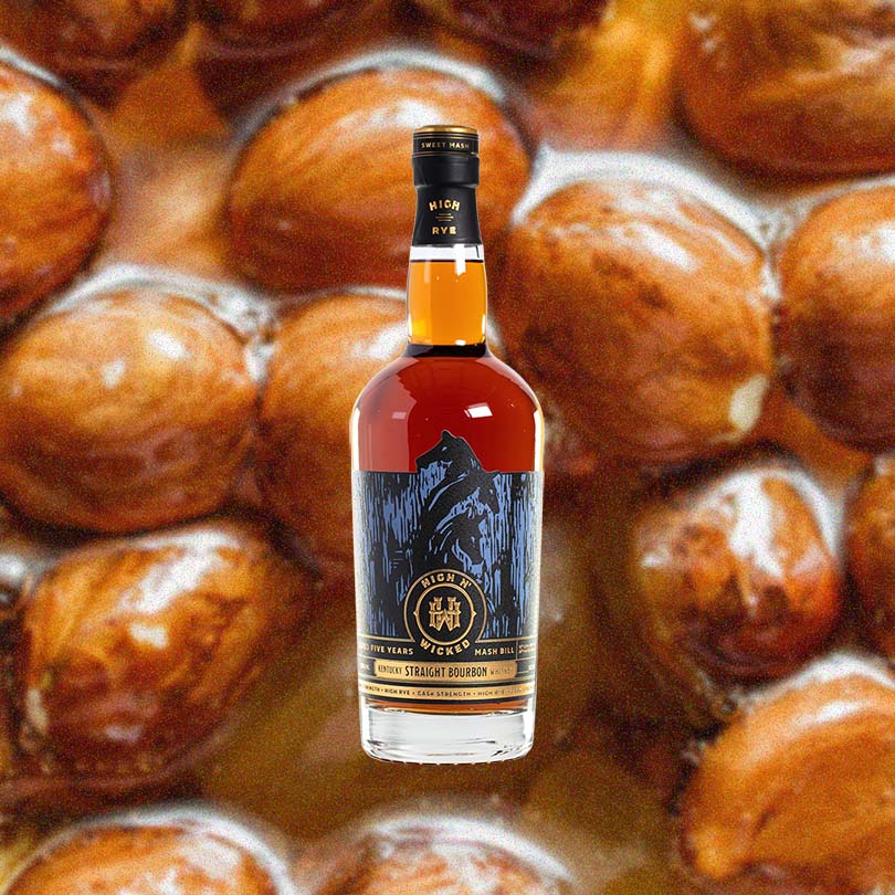 Bottle of High N' Wicked Cask Strength 5 Year Old Kentucky Straight Bourbon over back drop of candied nuts.