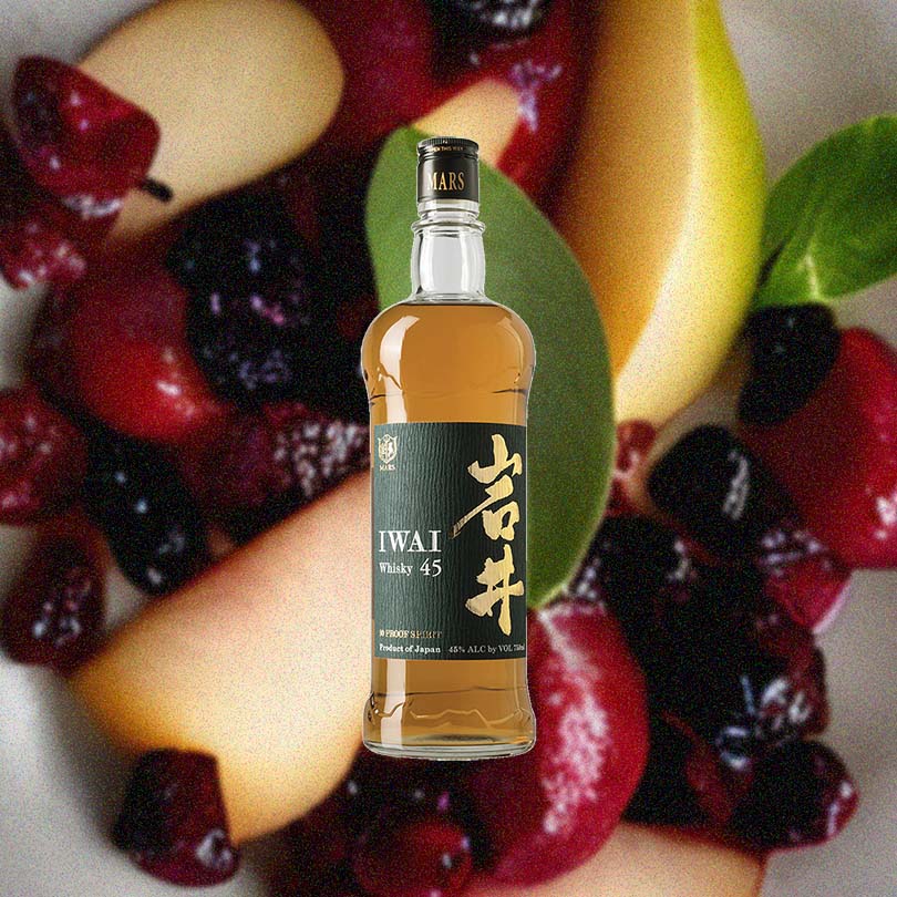 Mars Shinshu Iwai 45 Japanese Blended Whisky over background image of fruit.