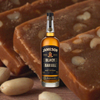 750ml bottle of Jameson Black Barrel Irish Whiskey over backdrop of pieces of dark fudge.