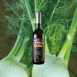 Bottle of Kübler Verte Suisse Absinthe 375ml over backdrop of green vegetable.