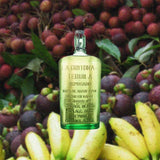 Bottle of La Gritona Reposado Tequila, over blurred background of assorted fruits.