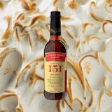 Bottle of Lemon Hart 151 Rum over backdrop of blurred marshmellow.