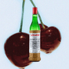Bottle Luxardo Maraschino Liqueur over a background of decadent maraschino cherries.