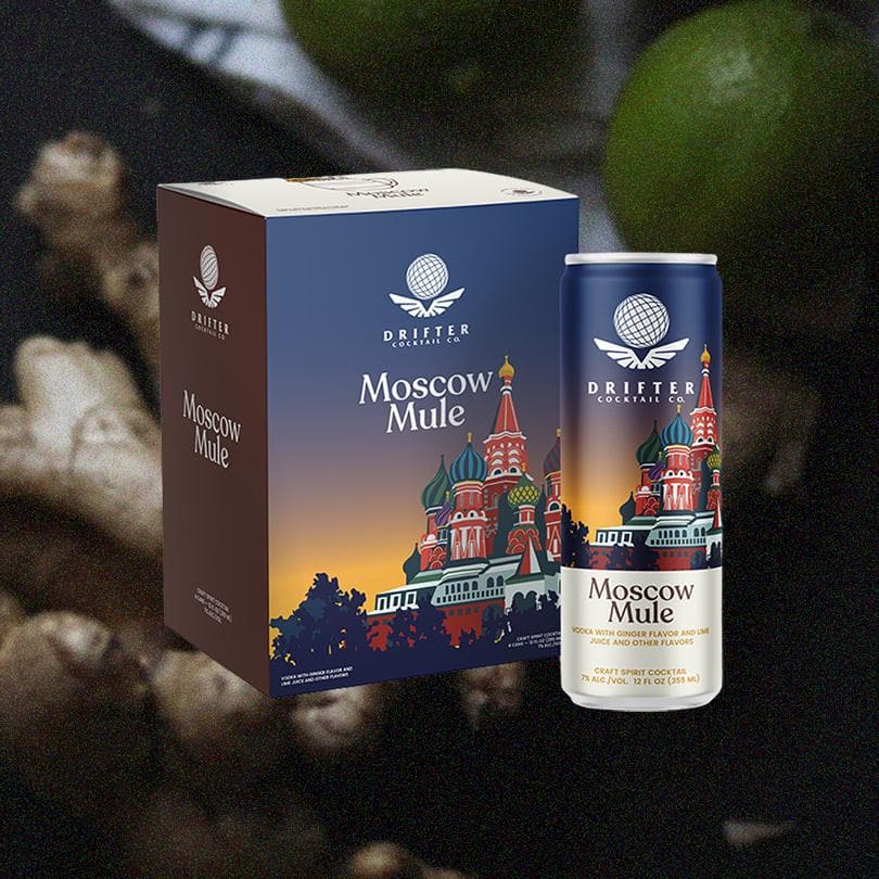 Packaging and can of Drifter Craft Cocktails: Moscow Mule, over blurred background of limes and ginger.