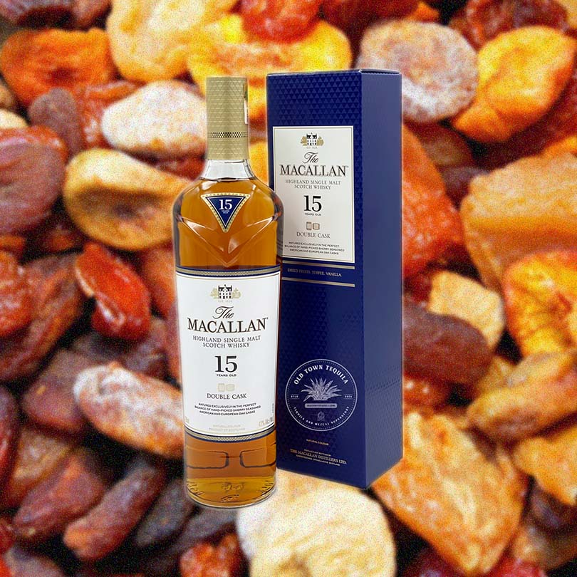 Bottle of Macallan 15 Year Old Double Cask Single Malt Scotch Whisky over background image of nuts and dried fruit.