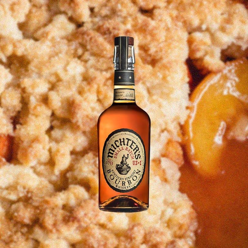 Bottle of Michter's US 1 Small Batch Bourbon over background image of apple pie crust.