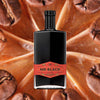 750ml bottle of Mr Black Coffee Amaro over backdrop of coffee beans.