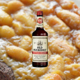 750ml bottle of Old Overholt Bonded Straight Rye Whiskey over backdrop of apple sauce.