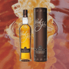 Bottle image of Paul John Edited Whisky and the package the box goes in. A backdrop of honey.