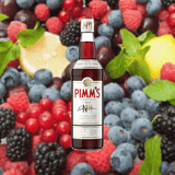 Bottle of Pimm's #1 Cup Spirit over backdrop of fresh fruit.