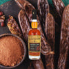 750ml bottle of Plantation Original Dark Rum over backdrop of spices and plantains.