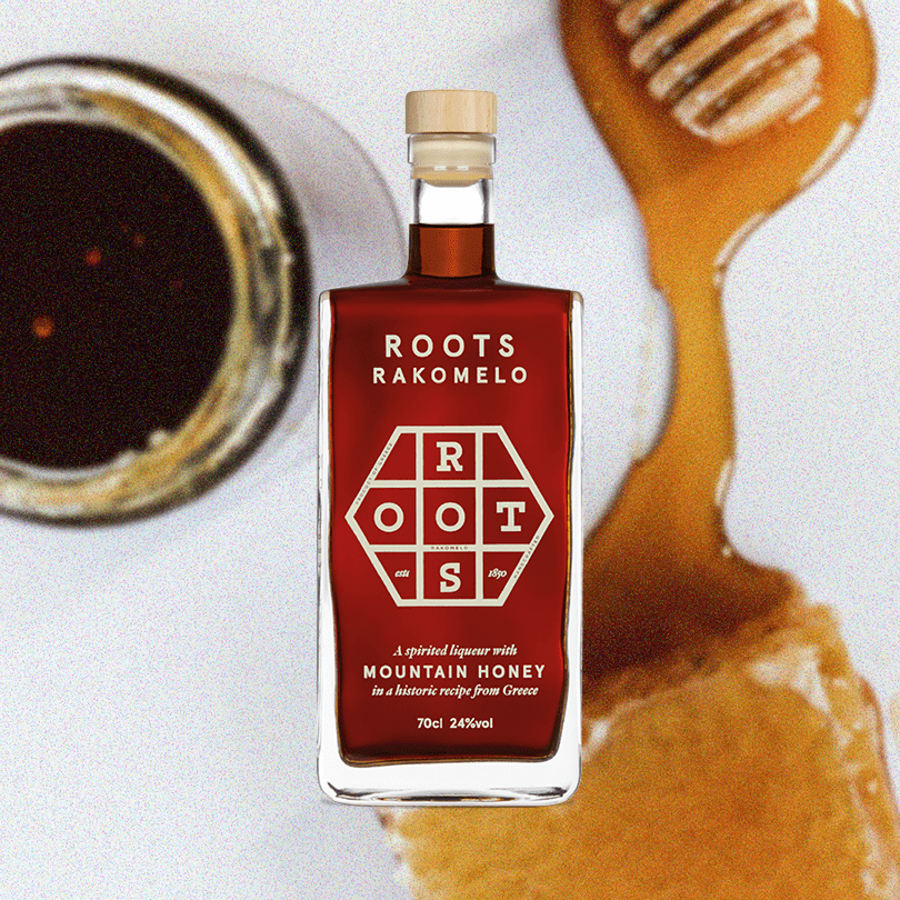 Bottle of Roots Rakomelo Sweet Liqueur, a jar of honey, and honeycomb covered in honey.