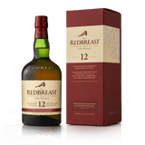 Bottle of Redbreast 12 Year Irish Whiskey next to red and white box the bottle is packaged in