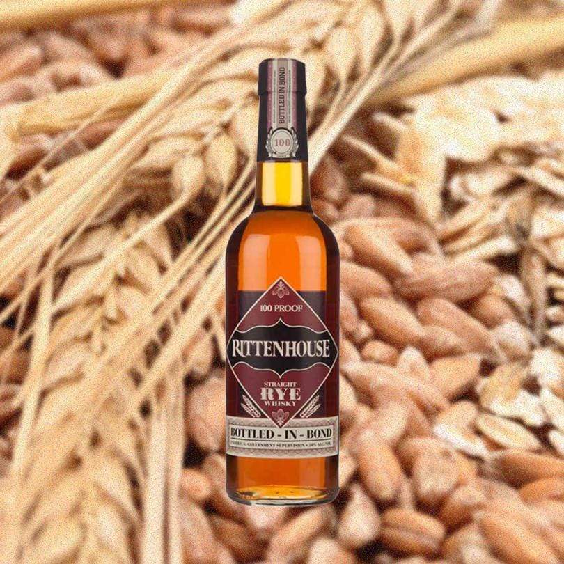 Bottle of Rittenhouse Rye 100 Proof over close-up backdrop of grains.