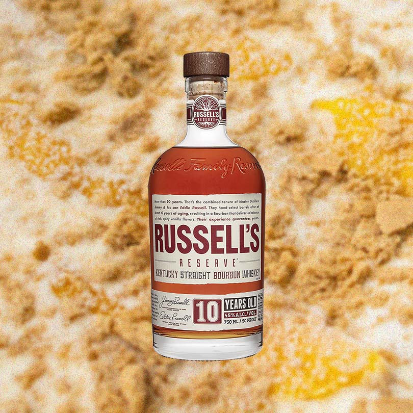750ml bottle of Russell's Reserve 10 Year Bourbon over backdrop of brown sugar.