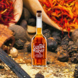 Bottle of Sazerac Straight Rye Whiskey over close-up backdrop of chilis and spices.