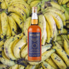 Bottle of Smith & Cross Traditional Jamaica Rum over background of bananas.