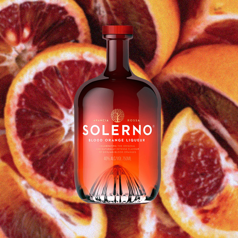 Bottle of Solerno Blood Orange Liqueur over image of blood oranges.