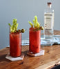 Two Bloody Marys on a table, made with St. George Green Chile Vodka