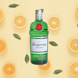 Bottle of Tanqueray Gin over minimalist backdrop of lemon slices and green petals.