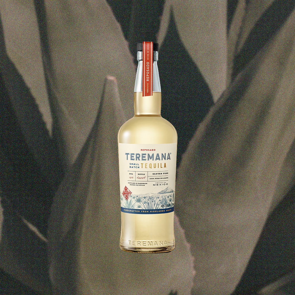 Bottle of Teremana Reposado Tequila, over blurred close up image of an agave plant.