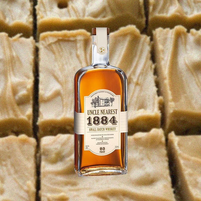 Bottle of Uncle Nearest 1884 Small Batch Whiskey in front of backdrop of peanut butter fudge.