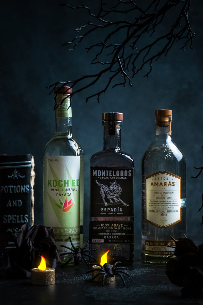 Bottles of Mezcal; Koch Espadin + Montelobos + Amaras in a spooky setting.
